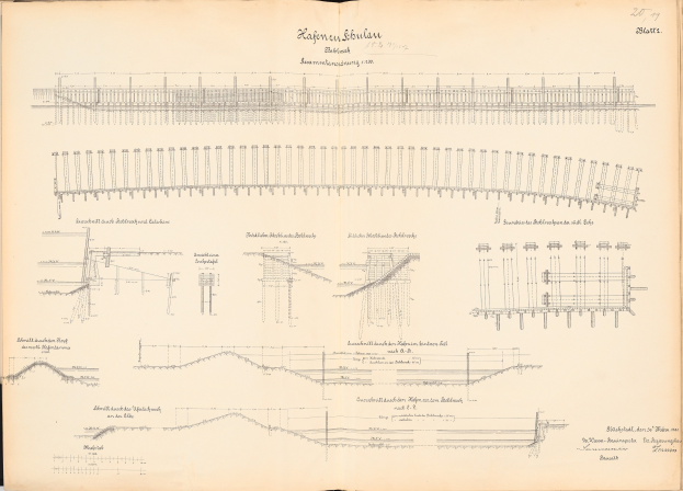 Offenes Buch mit detaillierten Zeichnungen und Text eines Eisenbahnsystems, einschließlich einer Illustration der Eisenbahnschienen.