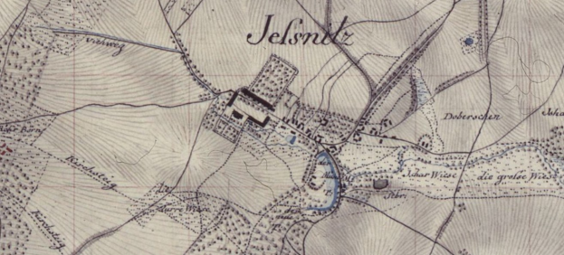 Detailiertes altes Stadtplan von Jelsnitz, Deutschland, zentriert auf einem Gebäude mit umgebender Text und Straßenlayout.