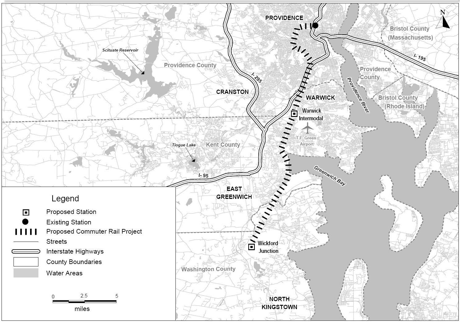 Schwarze und weiße Stadtkarte mit einem Fluss, beschriftet mit "Proposed Commuter Rail Project" auf der linken Seite, zeigend Straßen, Highways und Stadtmerkmale.