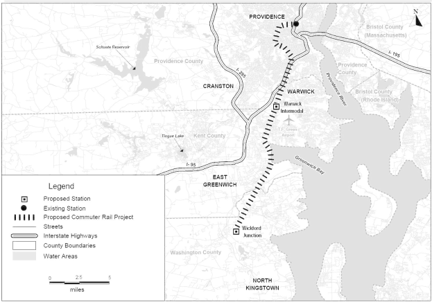 Schwarze und weiße Stadtkarte mit einem Fluss, beschriftet mit "Proposed Commuter Rail Project" auf der linken Seite, zeigend Straßen, Highways und Stadtmerkmale.