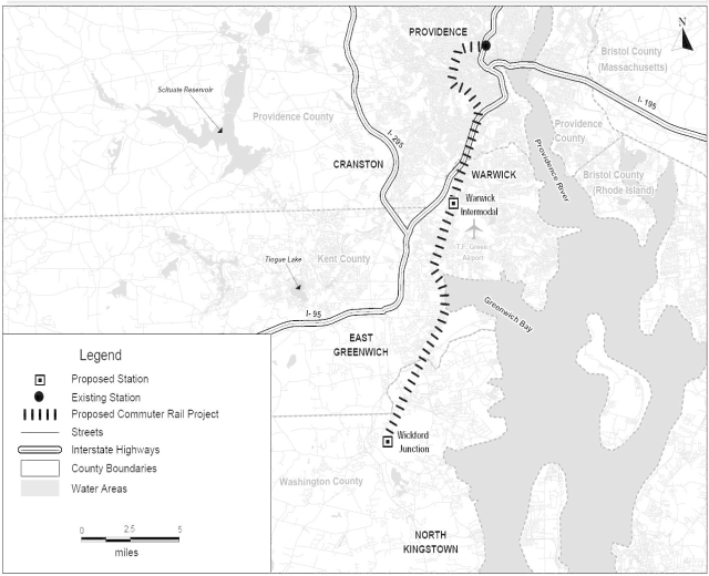 Schwarze und weiße Stadtkarte mit einem Fluss, beschriftet mit "Proposed Commuter Rail Project" auf der linken Seite, zeigend Straßen, Highways und Stadtmerkmale.